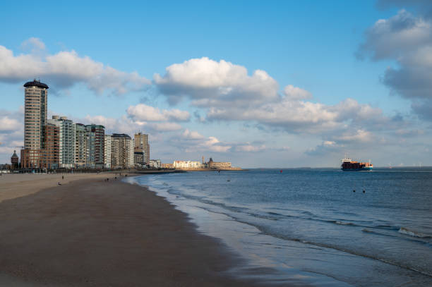 istock Waterfront, dunes and view on Vlissingen city with sandy beach on sunset 1321333019