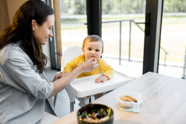 istock Young mom with her baby boy during a lunch time 1321333859