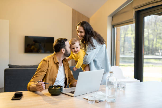 istock Father works from home with his family 1321334071