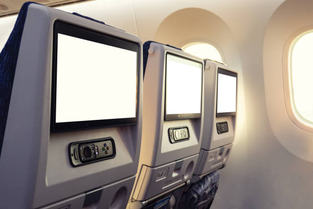 istock Row airplane seat with empty display and joystick by window 1321334119