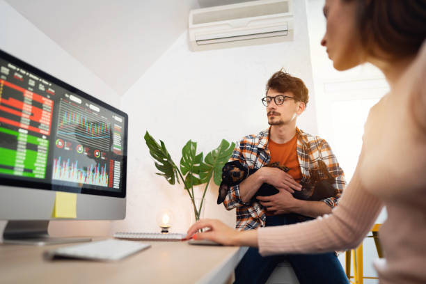 istock Two young people trading cryptocurrencies on a computer at home together 1321334219