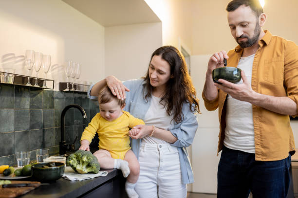 istock Family with a baby on the kitchen 1321334230
