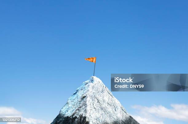 Orange Flag Planted On Top Of Snow Capped Peak Stock Photo - Download Image Now - Mountain Peak, Flag, Mountain