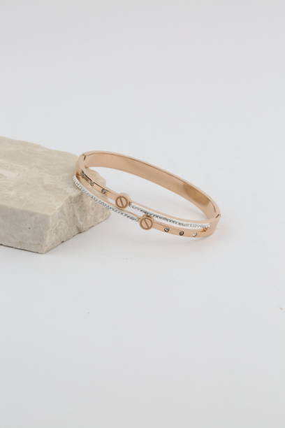 istock women's bracelet front of white background. 1321337134