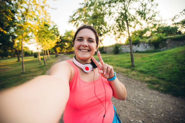istock Oversized woman selfie at running 1321339464