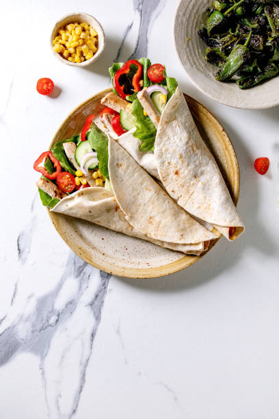 istock Traditional mexican tortila wrap with pork meat 1321342932