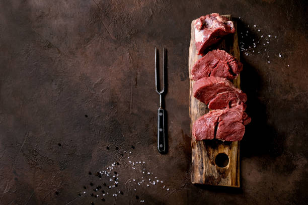 istock Fresh whole raw beef tenderloin on wooden board 1321342968
