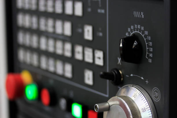 istock switches and rotary wheel on CNC control panel 1321343455