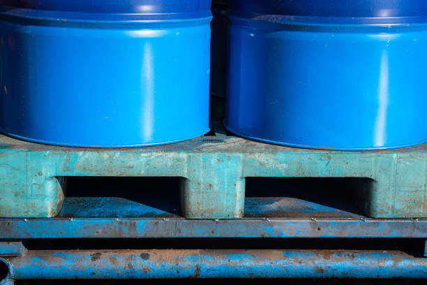istock Chemical barrels placed on plastic pallet with hole for forklift lifting. 1321344834