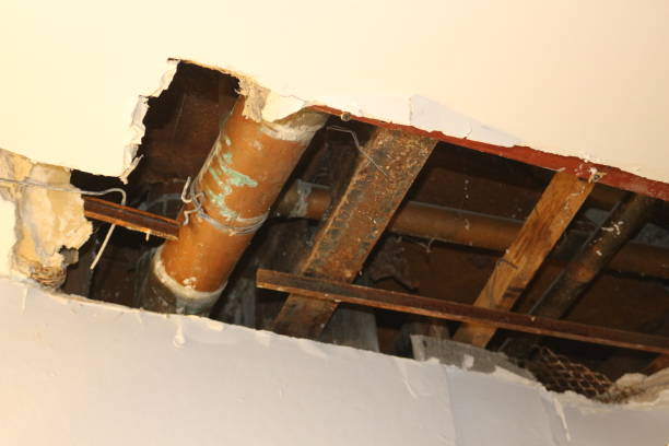 istock a hole in ceiling showing plumbing 1321344852