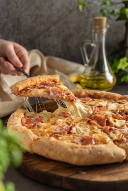 istock selective focus. hot pizza with cheese and pepperoni 1321344920