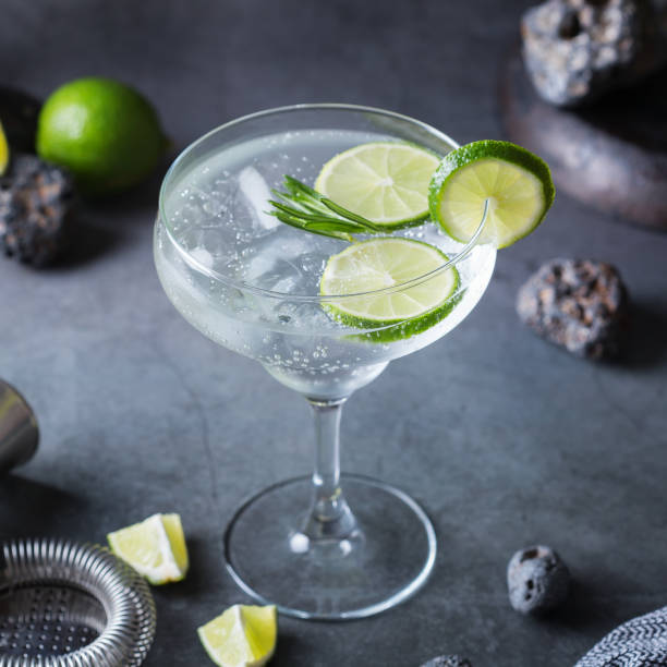 istock Hard seltzer cocktail with lime, rosemary and bartenders accessories 1321345021