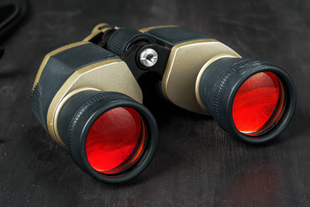 istock Hunting binoculars with red lense, close up 1321347349