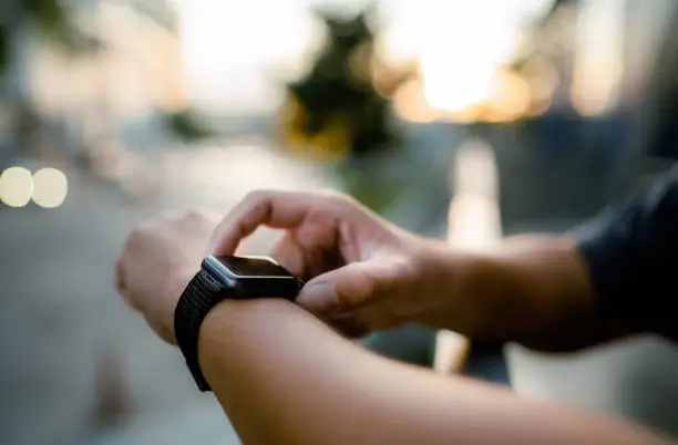 Photo of Close up hands touching The Smart Watch And Technology .