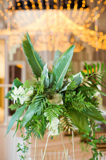istock Exotic flower composition with palm leaves 1321352403