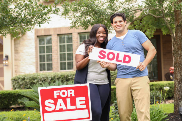 istock Excited young couple buys their first home. 1321354985