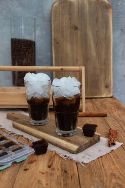 istock Cold coffee with milk and ice cubes with flowers 1321354998