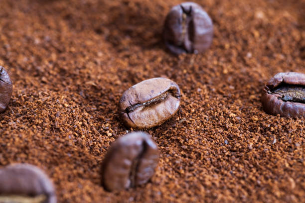 istock roasted coffee beans are placed on ground coffee 1321355771