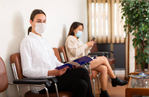 istock Positive woman waiting at hall at office 1321357125