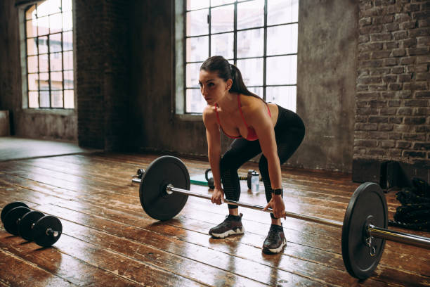 istock female bodybuilder training at the gym 1321357322