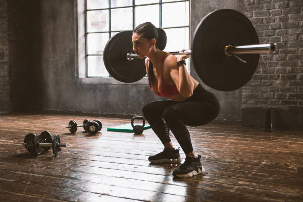istock female bodybuilder training at the gym 1321357390