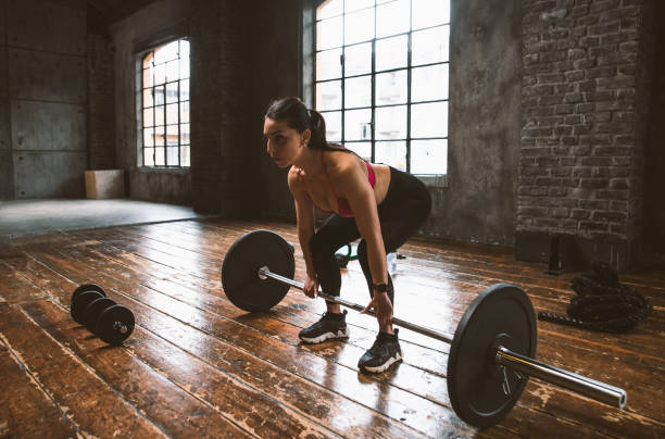 istock female bodybuilder training at the gym 1321358403