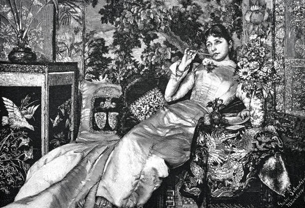 illustrations, cliparts, dessins animés et icônes de une jeune femme sur un canapé écrit une lettre à son amant, la plume dans sa bouche, rêvant pensivement - women white caucasian image created 19th century