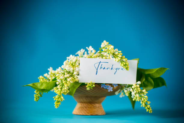 istock bouquet of white lilacs with greeting card 1321358786