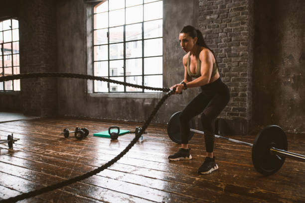 istock female bodybuilder training at the gym 1321360656