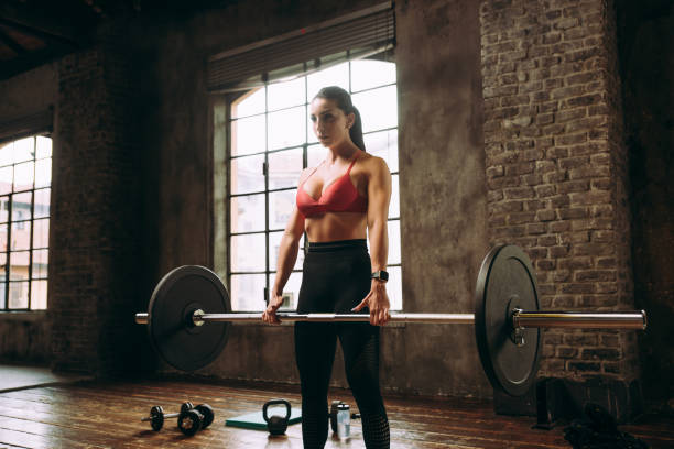 istock female bodybuilder training at the gym 1321361980