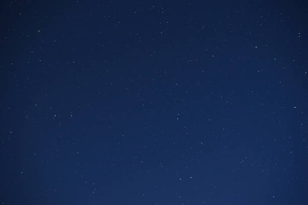 istock Astrophotography blue starry sky in summer at night 1321362070