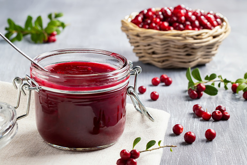 istock Glass jar with homemade lingonberry sauce. Canning lingonberry sauce 1321362385