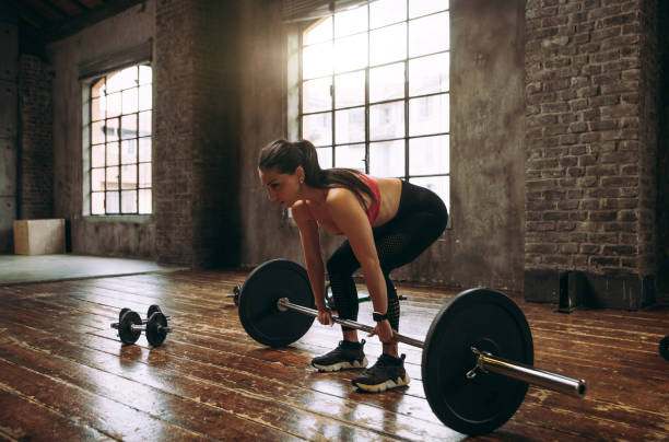 istock female bodybuilder training at the gym 1321362411