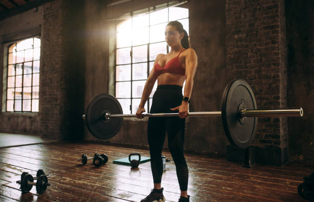 istock female bodybuilder training at the gym 1321363202