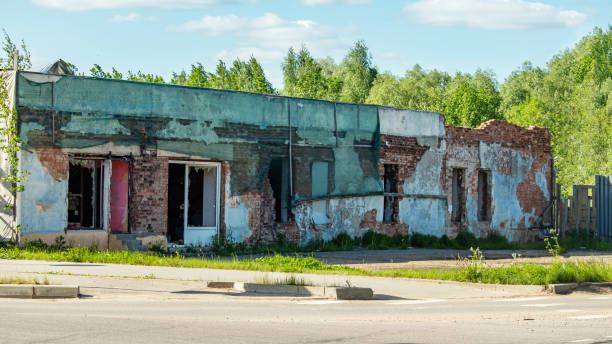 istock broken windows of an old ruined brick house 1321366108