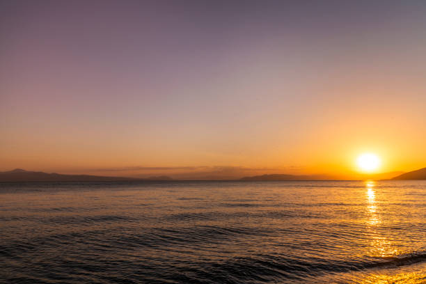 istock Beautiful sunset on the lake with mountains. Summer landscape. 1321368951