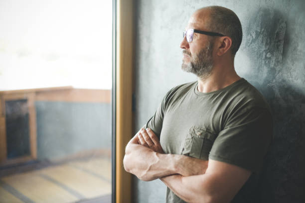 istock mature adult man ( gray background) 1321370230