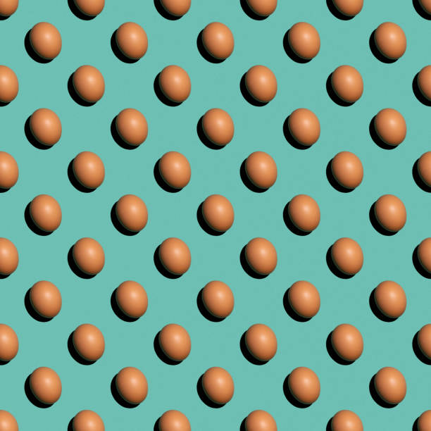 istock Seamless texture background pattern from eggs on a colored background. Minimal food concept. 1321371461