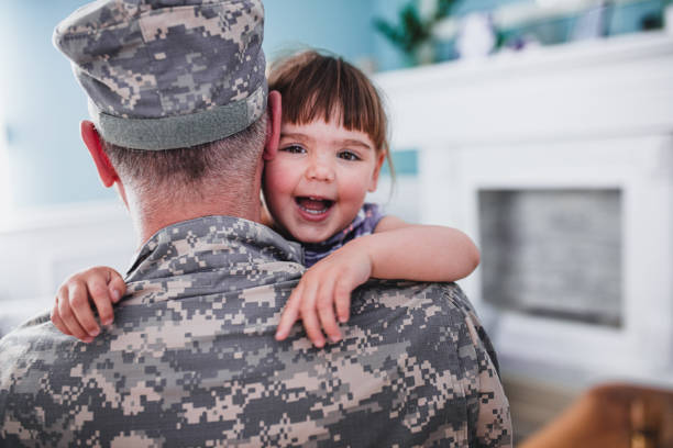 istock A soldier is playing at home with his daughter 1321380411