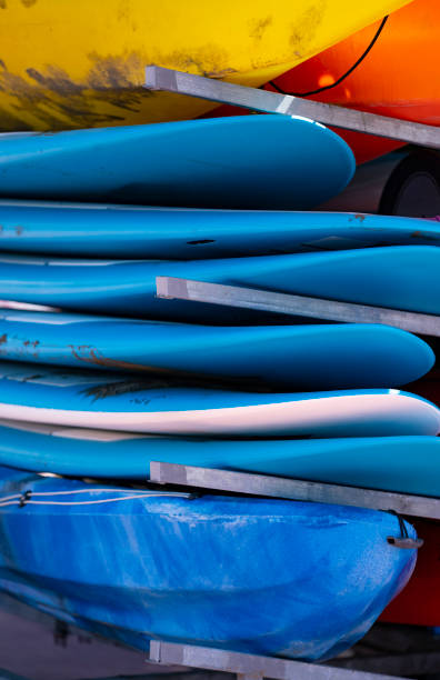 istock bunch of piled blue surfboards 1321383626