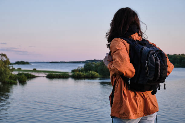 istock The girl climbs a rocky mountain 1321386185