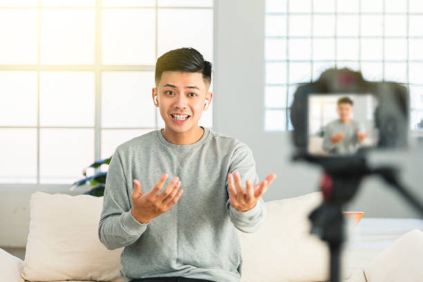 istock Young man recording video for an internet tv show or tutorial streaming 1321392457