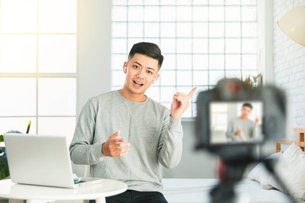 istock Young man recording video for an internet tv show or tutorial streaming 1321392630