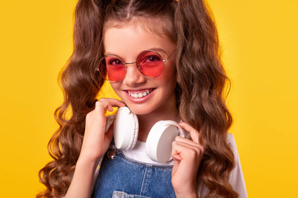 istock Happy kid with headphones smiling 1321401423
