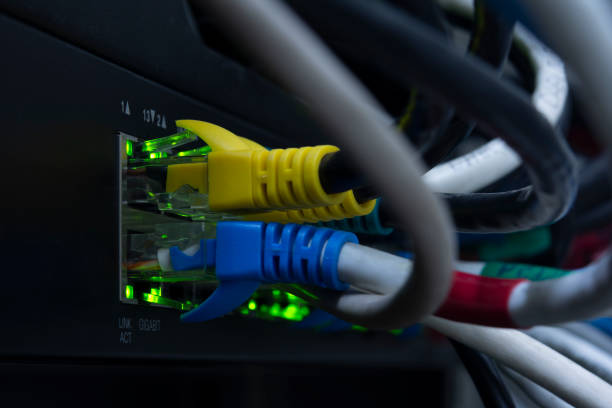 istock Close-up network equipment in server room and Ethernet UTP Cat6 installed in the rack. 1321407700