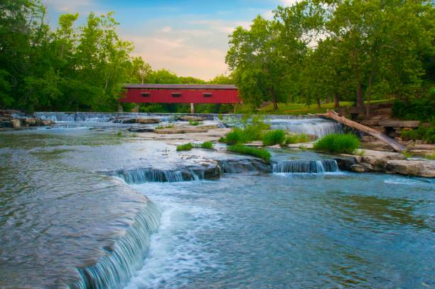 istock Waterfall-Cataract Falls-with covered bridge- On Mill Creek-Owen County Indiana 1321407798