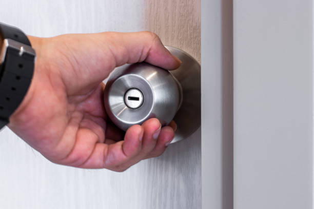 istock Men's hand opens and closes the door.