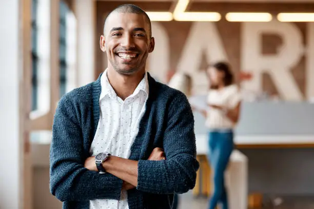 Photo of Portrait of a confident young businessman working in a modern office