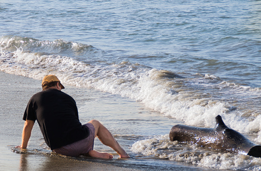 A photoshoot of a senior men enjoying his retired life at the beach