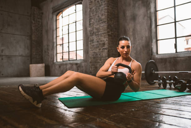 istock female bodybuilder training at the gym 1321415210